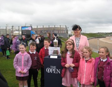 Some P4 and P5 pupils get their hands on the Claret Jug!