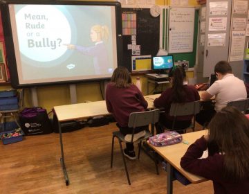 Primary Six/Seven discussing how to deal with different types of bullying.